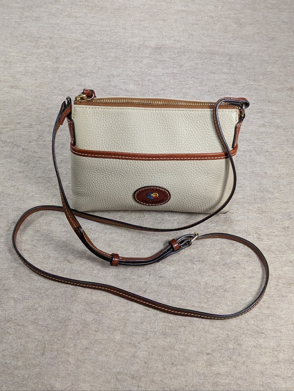 Dooney & Bourke Cream Pebble Leather Crossbody Autism Awareness Patch Small Bag